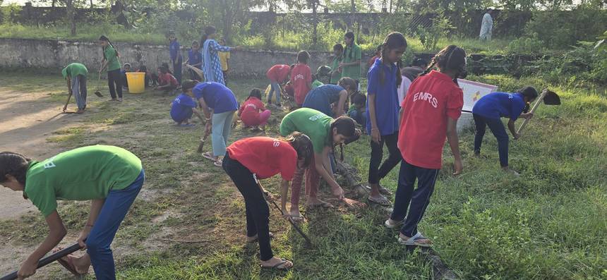 Students and staff working together on campus greening and clean up